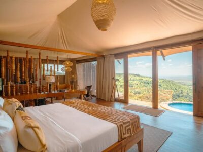 Luxury tented camp accommodation on a Kenya safari with views of the wild.