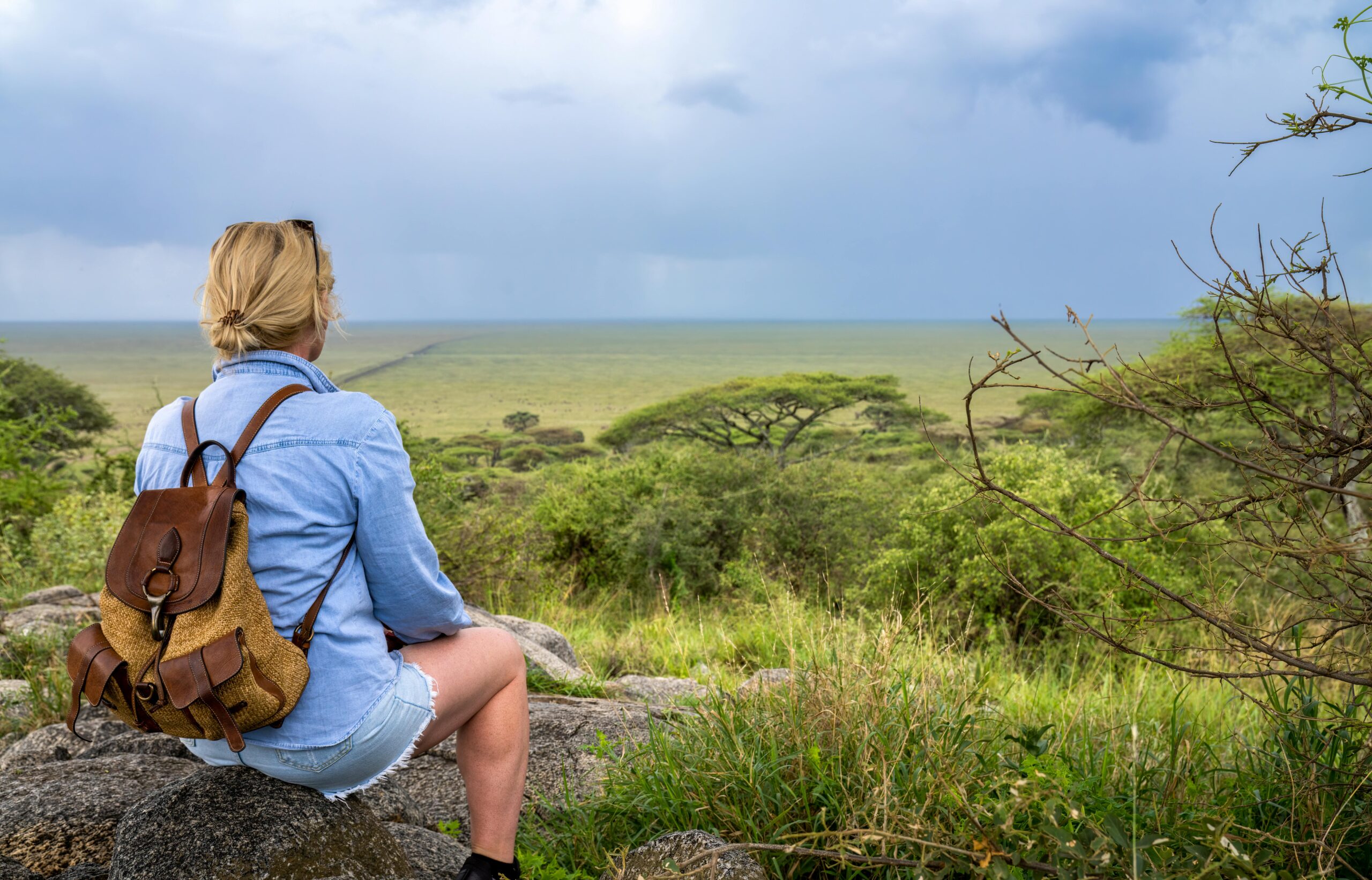 solo female traveler enjoying a hiking adventure in kenya