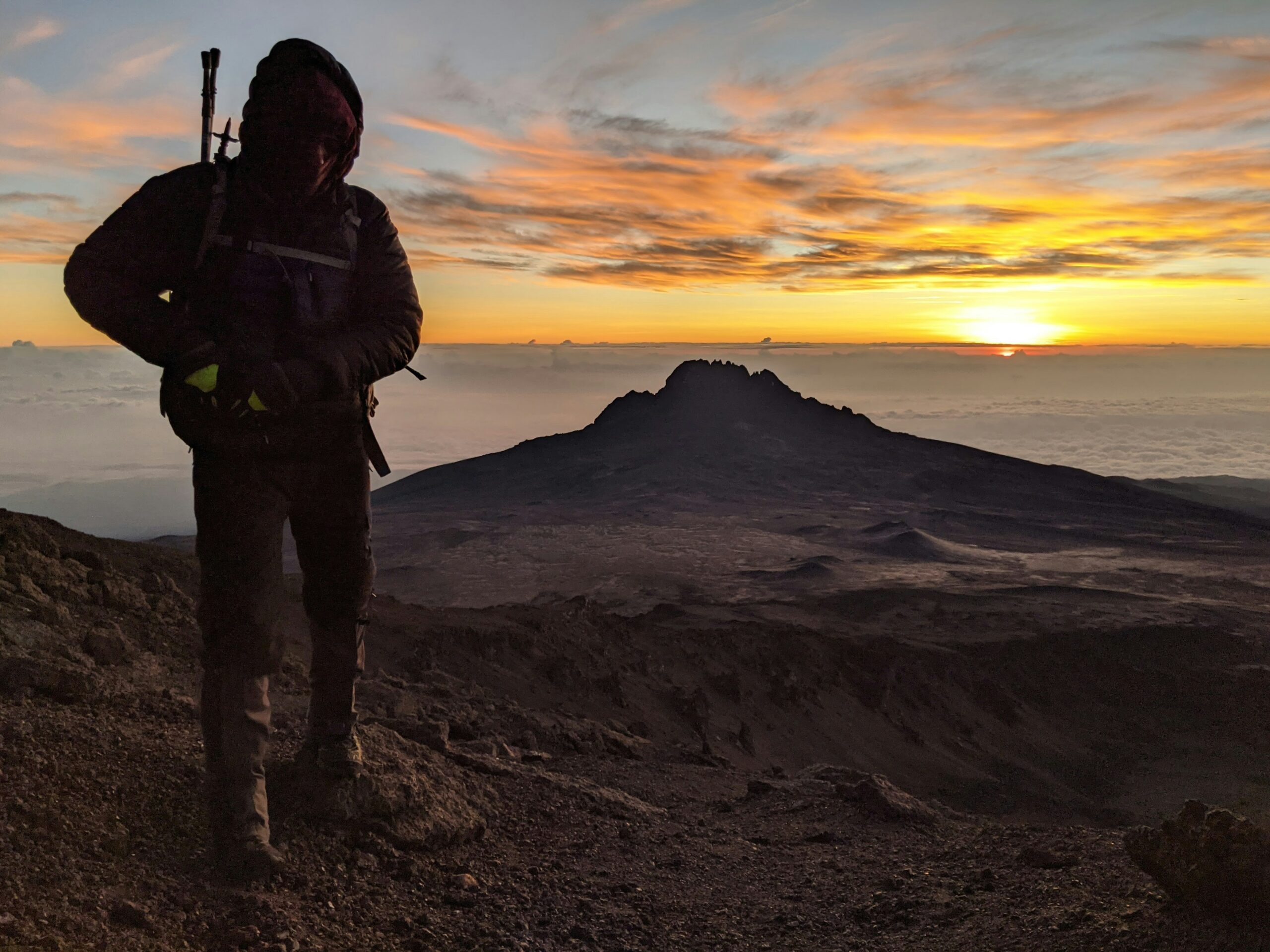 Stunning sunrise over Mount Kilimanjaro's Uhuru Peak with glowing snow.